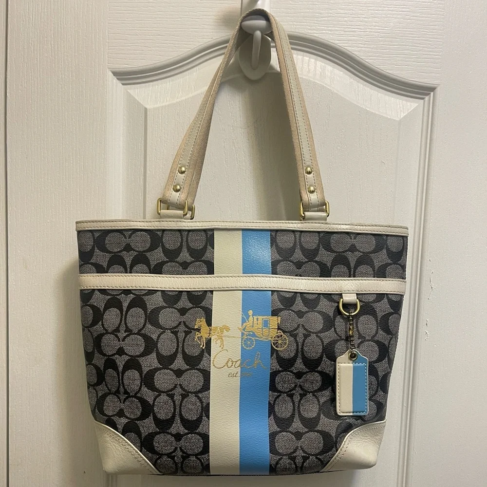 Coach bag gray and black with blue and white stripes gold logo in the front